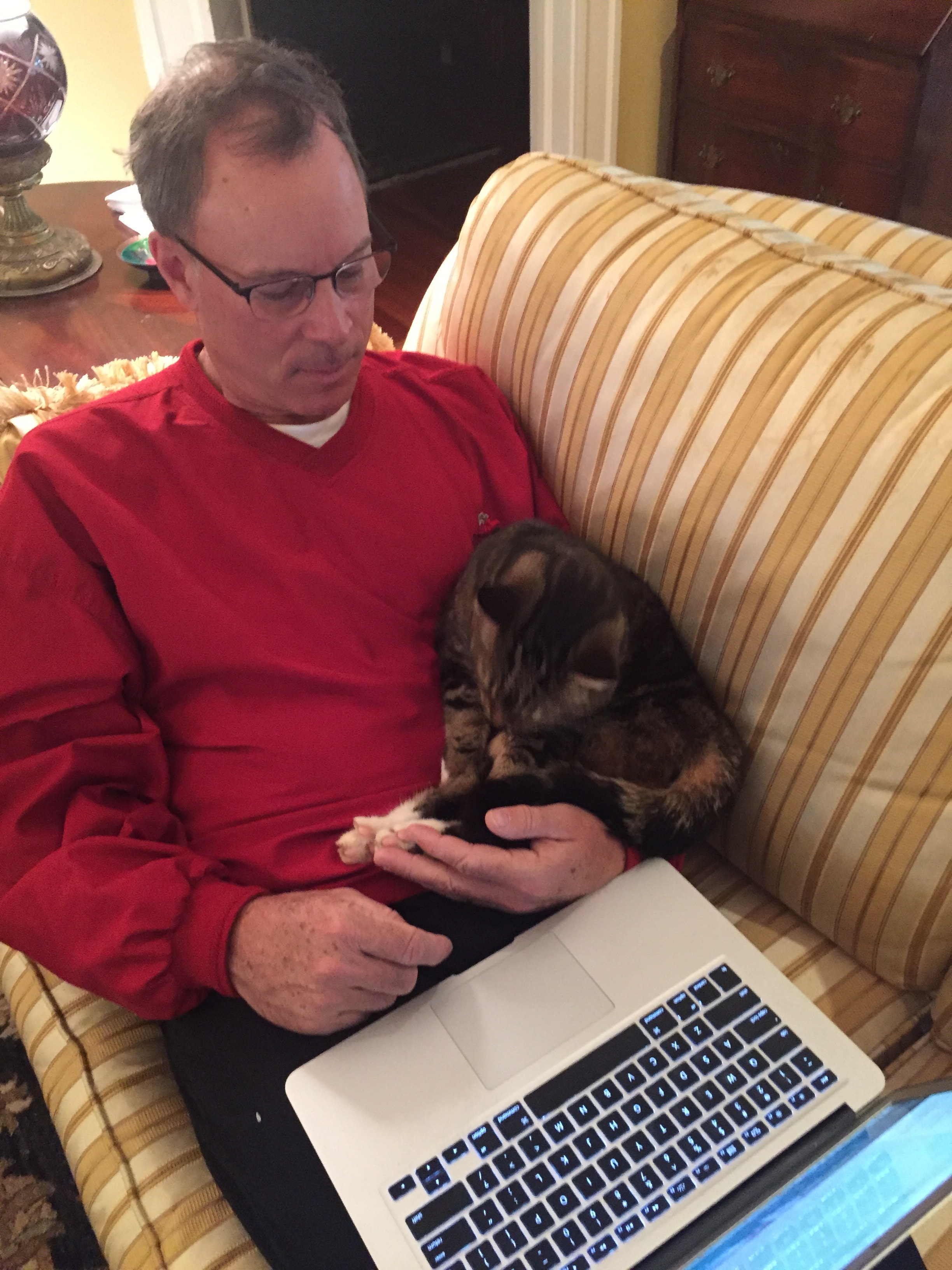 Paul Winum relaxing at home with his cat while working on The Shuggle